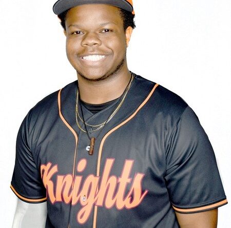 Young man in Knights baseball uniform and cap
