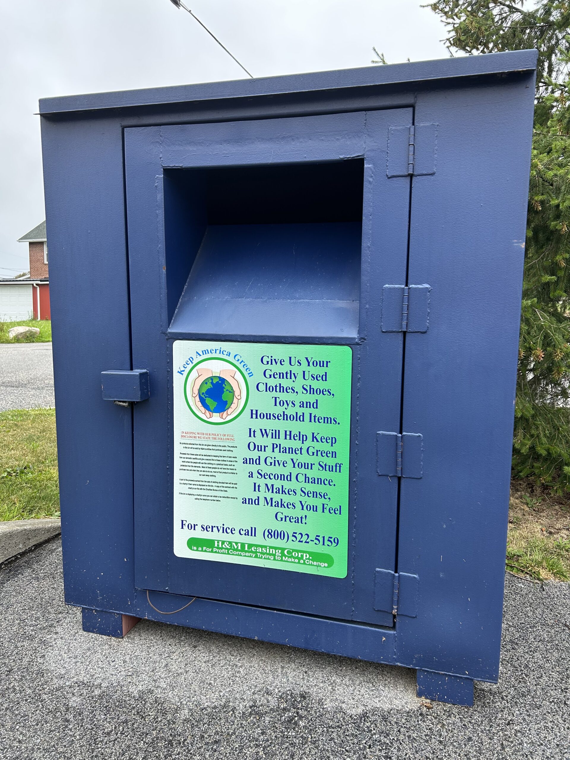 Blue parking lot clothing and shoes donation bin
