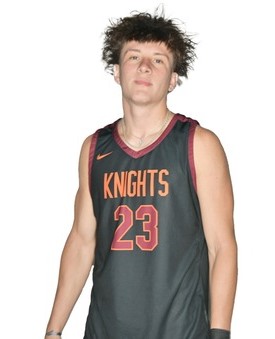 Young man with curly dark hair in an orange-on-black basketball uniform with Knights and 23 on the jersey front in orange outlined in white