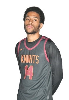 Young man with short dark hair and close-cropped beard in an orange-on-black basketball uniform with an Orange Knights and 14 on the jersey front, with those outlined in white