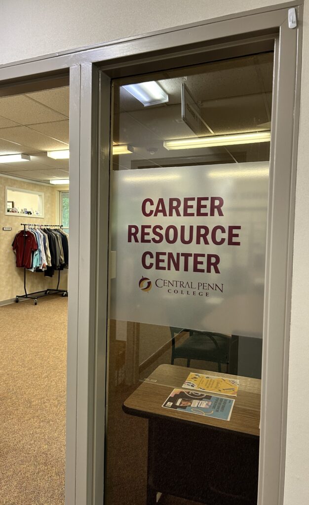 Photo of door glass with "Career Resource Center @ Central Penn College" om maroon letters.