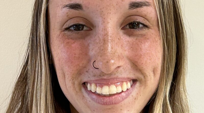 Smiling young blonde woman with freckle. Hannah Pasquarella