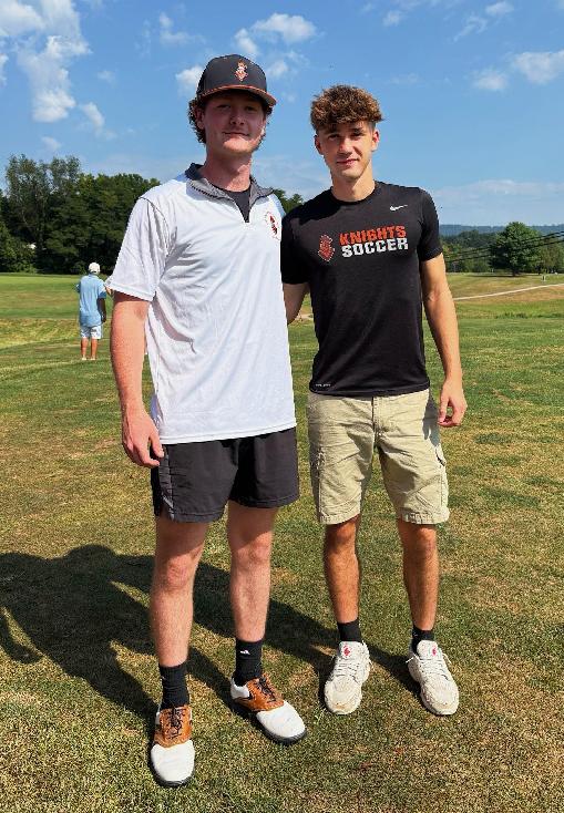 Two young men, one in a black T-shirt and one in a white T-shirt, wearing baseball caps. Central Penn students David Cameron, left, and Blake Eiserman, volunteer with Colleges Against Cancer, at Central Penn College
