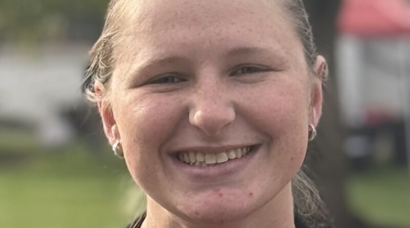 Smiling young woman with tied-back blond hair. Central Penn College Volleyball coach Jessica Dunbar