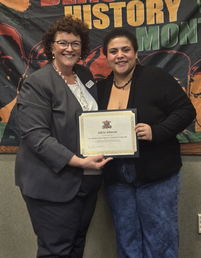 Central Penn Associate Vice President of Student Services and Jalicia Johnson each hold a side of Johnson's Dr. Martin Luther King Jr. Award for Leadership. certificate.
