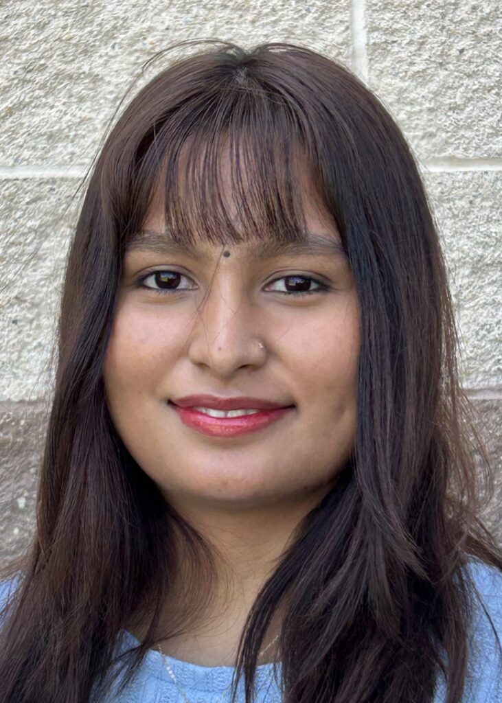young smiling woman with long dark hair. Apichikya Lohar