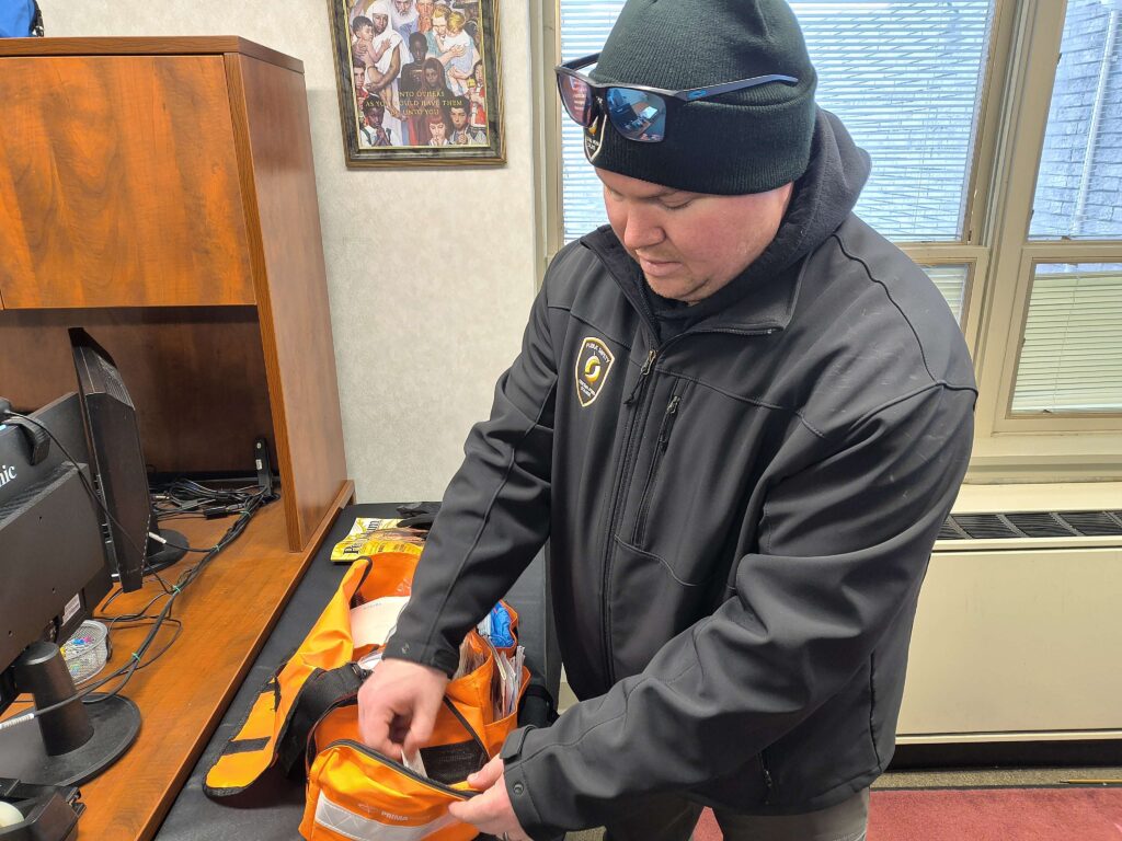 Mrakovich with a first aid kit. Photo by Alex Foley.